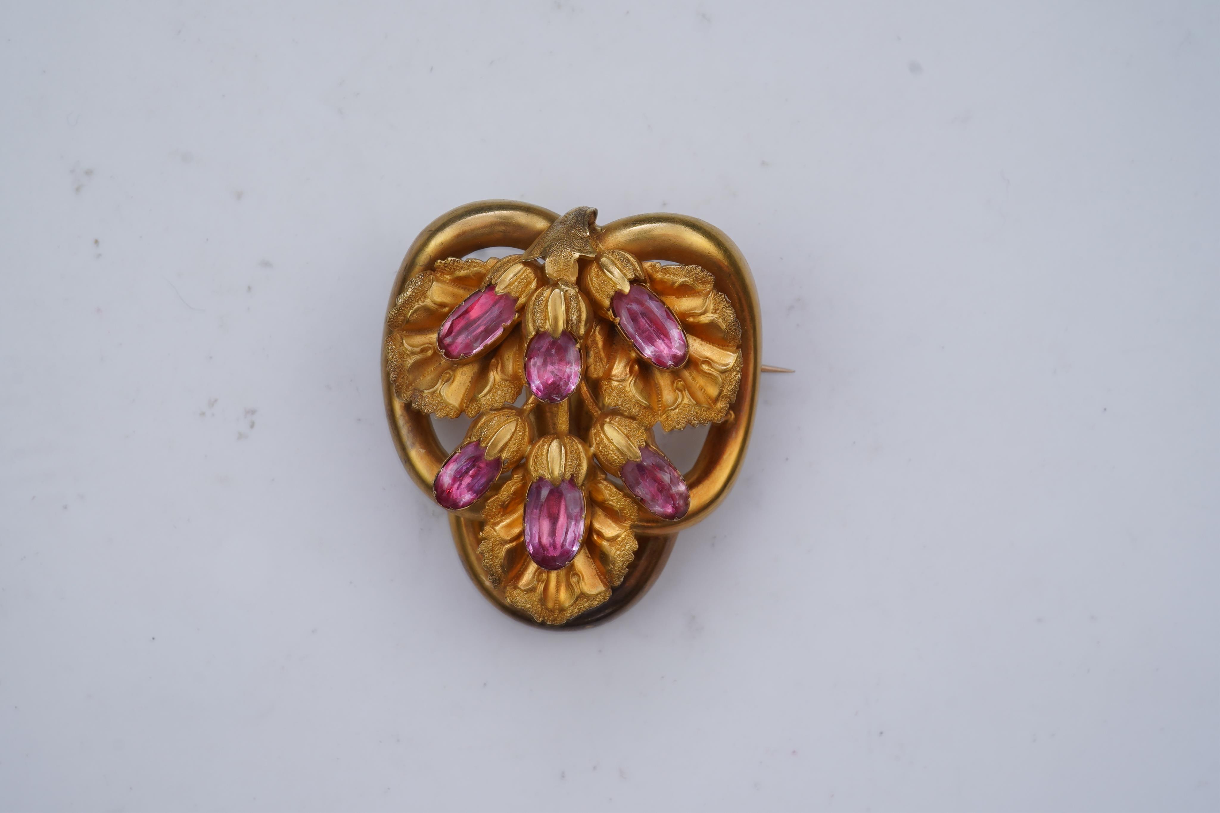 A gold and pink topaz brooch, mid 19th century